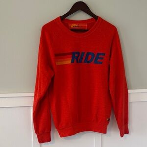 Orange crewneck sweatshirt